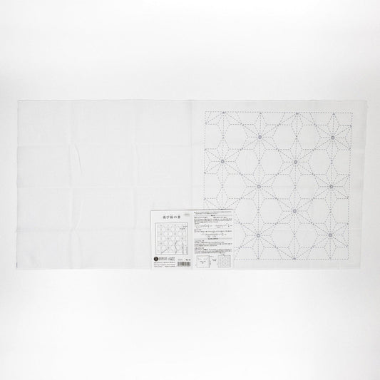 The image is a white sheet of paper with a detailed pattern or design on it, along with some text or instructions below it.