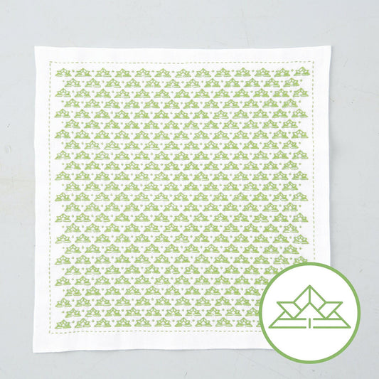 a square piece of fabric with a repeating pattern of green triangles.