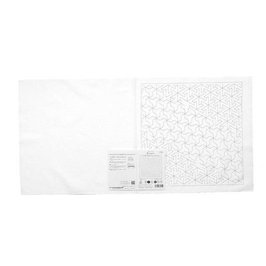 The image is a white piece of paper with a grid pattern of small black dots, resembling a cross-stitch design.