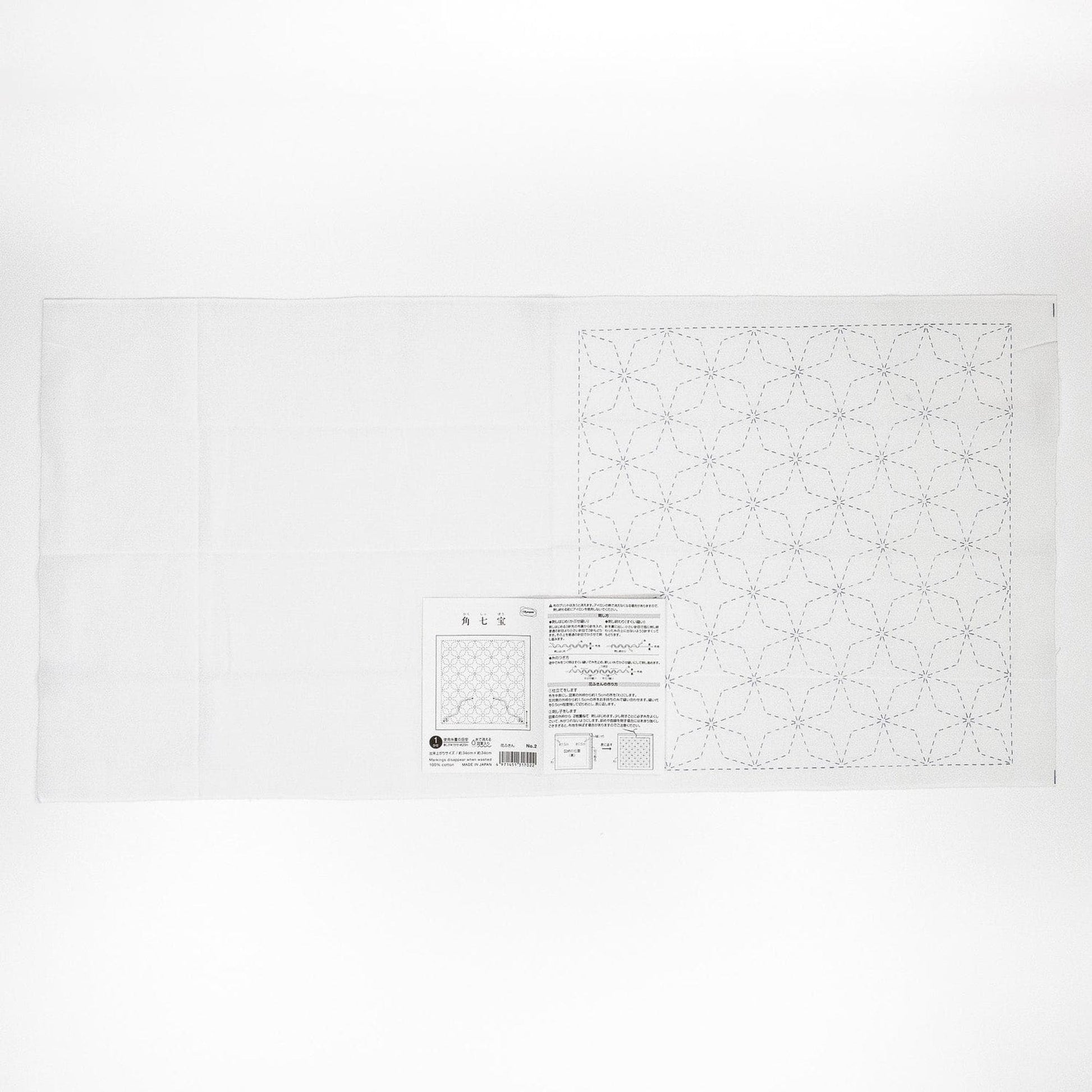 The image is a white sheet of paper with a black and white pattern or design on it.
