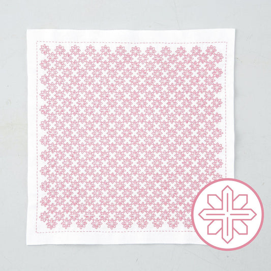 a square piece of fabric with a repeating pink floral pattern.