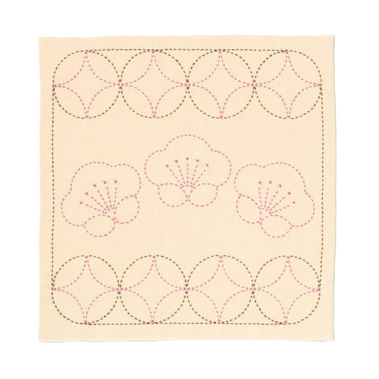 a square with a repeating pattern of pink flowers and circles.
