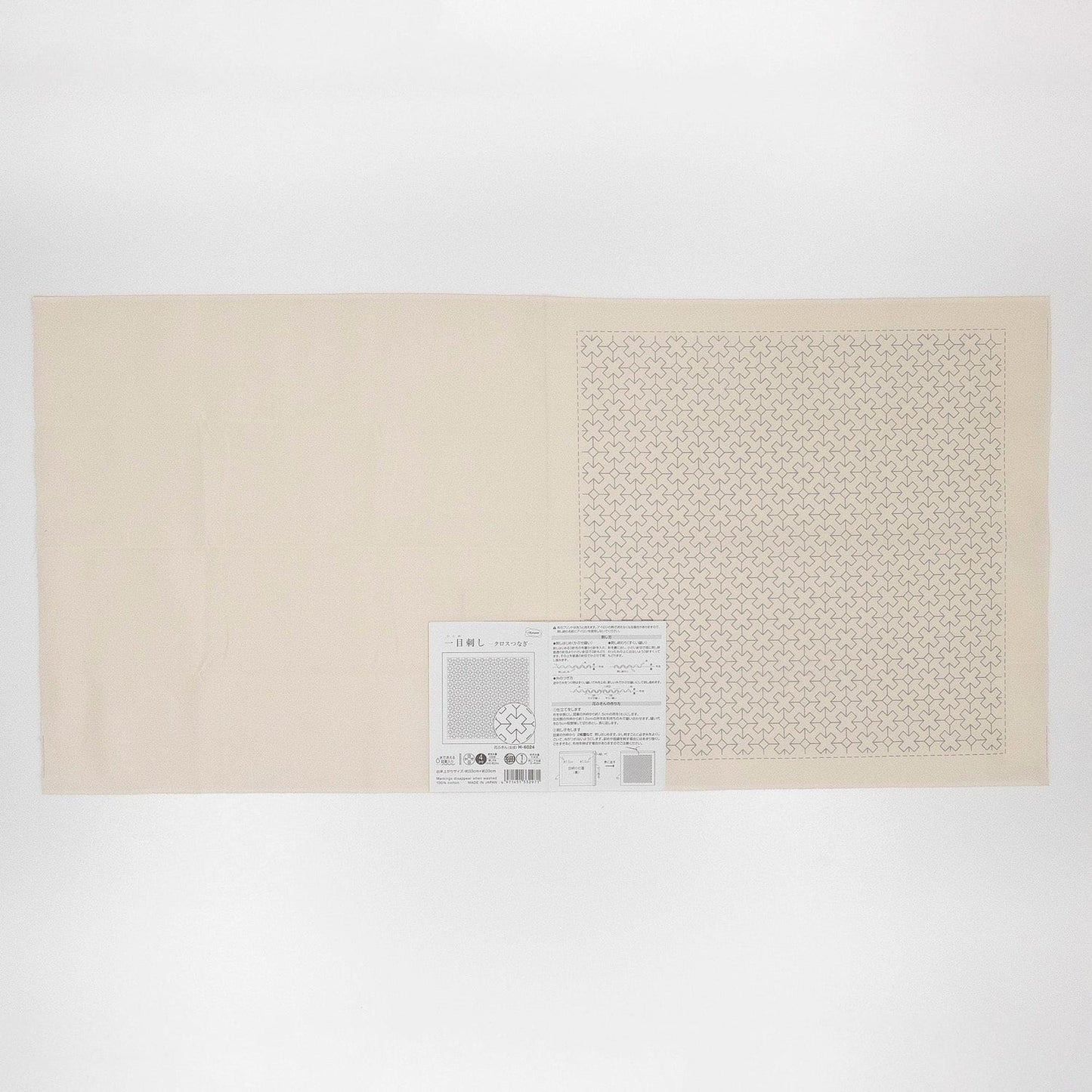 The image is a plain white sheet of paper with a small square pattern on it.