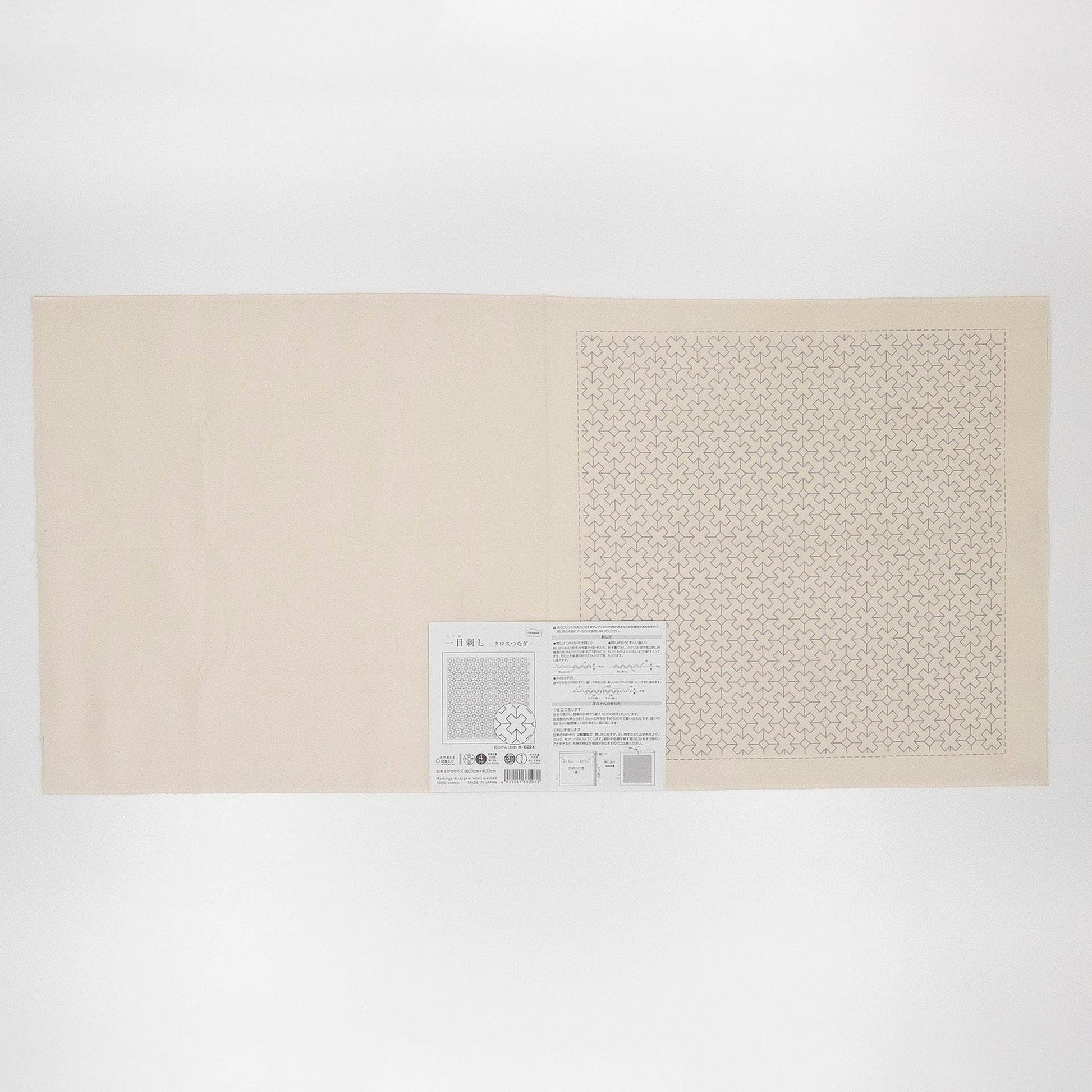 The image is a plain white sheet of paper with a small square pattern on it.