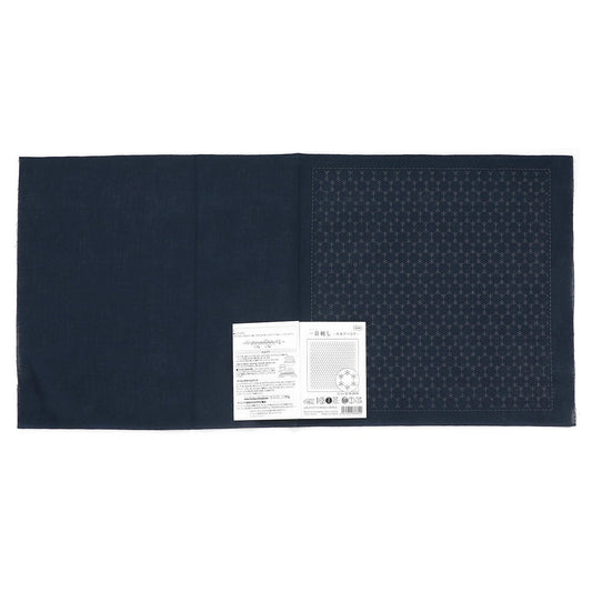 The image is a black fabric with a white label attached to it, which appears to be a product label or instructions.