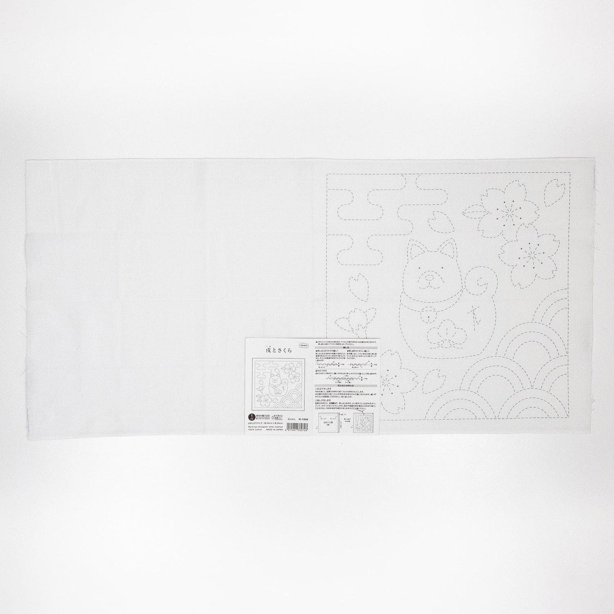 The image is a white sheet of paper with a black and white illustration of a cat and flowers.