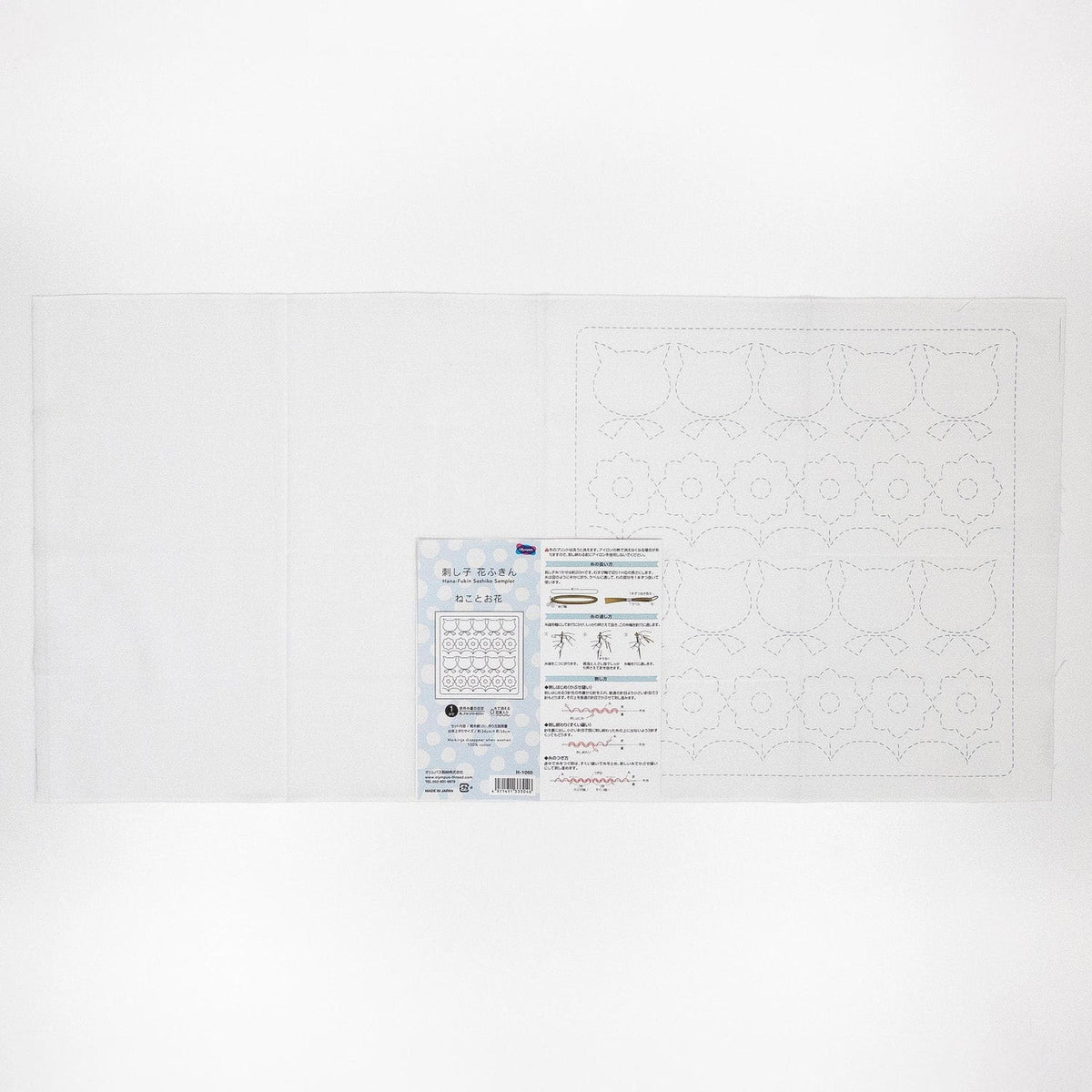 The image is a plain white background with a printed instruction sheet or label placed on it.
