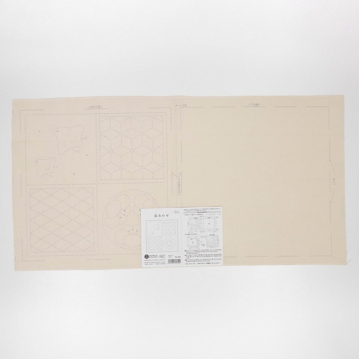 The image is a large piece of paper with a printed diagram and a small printed sheet of paper with text and diagrams on it.