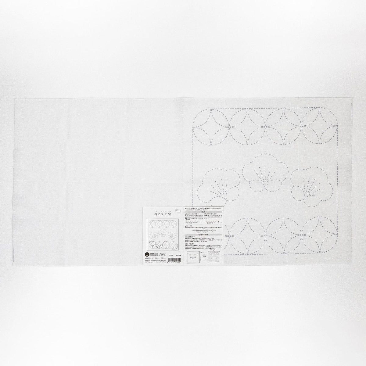 The image is a white sheet of paper with a detailed embroidery design and instructions for a sewing project.