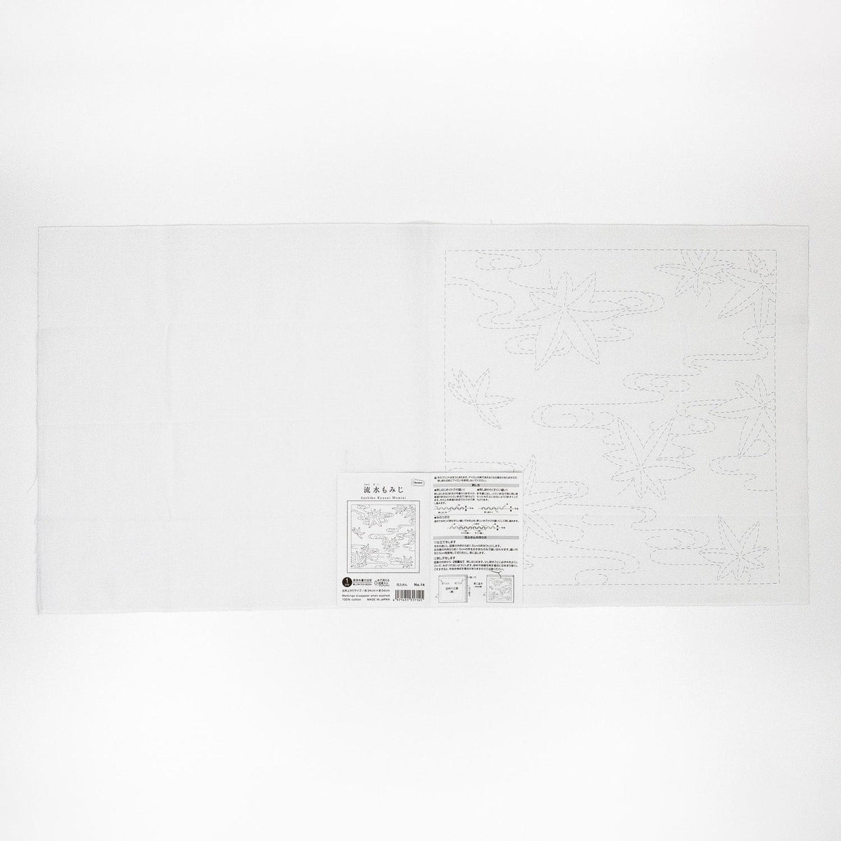 The image is a white sheet of paper with a black and white design featuring a pattern of leaves and flowers.