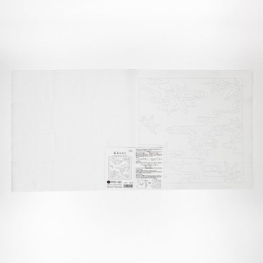 The image is a white sheet of paper with a black and white design featuring a pattern of leaves and flowers.