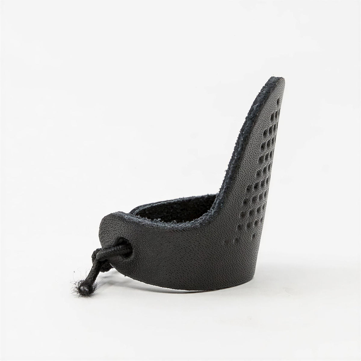 A black leather finger ring with a perforated design.