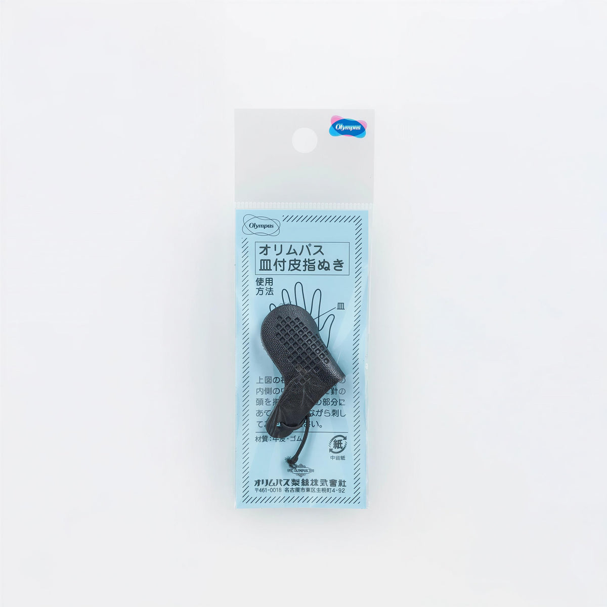 A package containing a black object, possibly a tool or accessory, with Japanese text and a blue label.