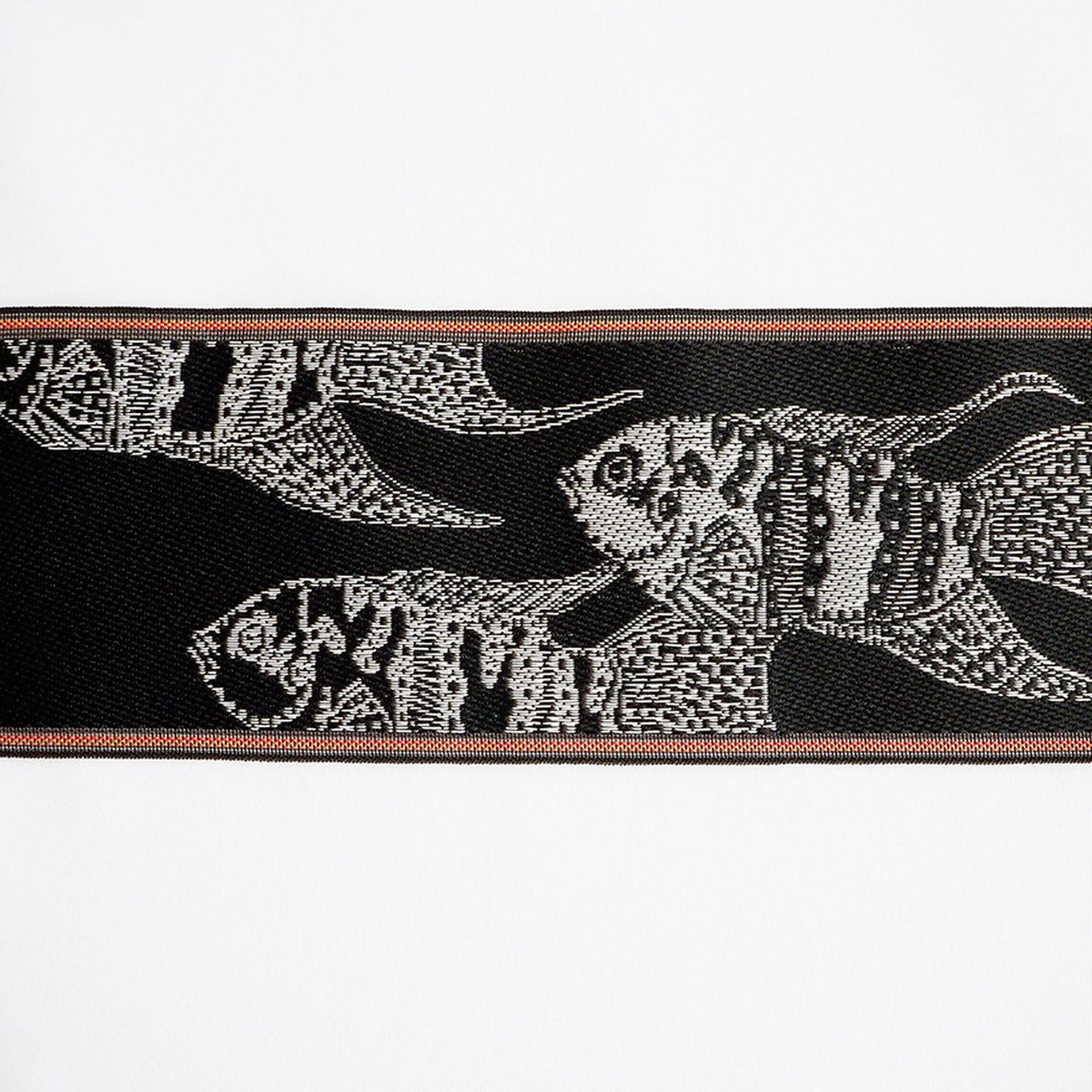 a black and white fish design on a black background, with a red border.