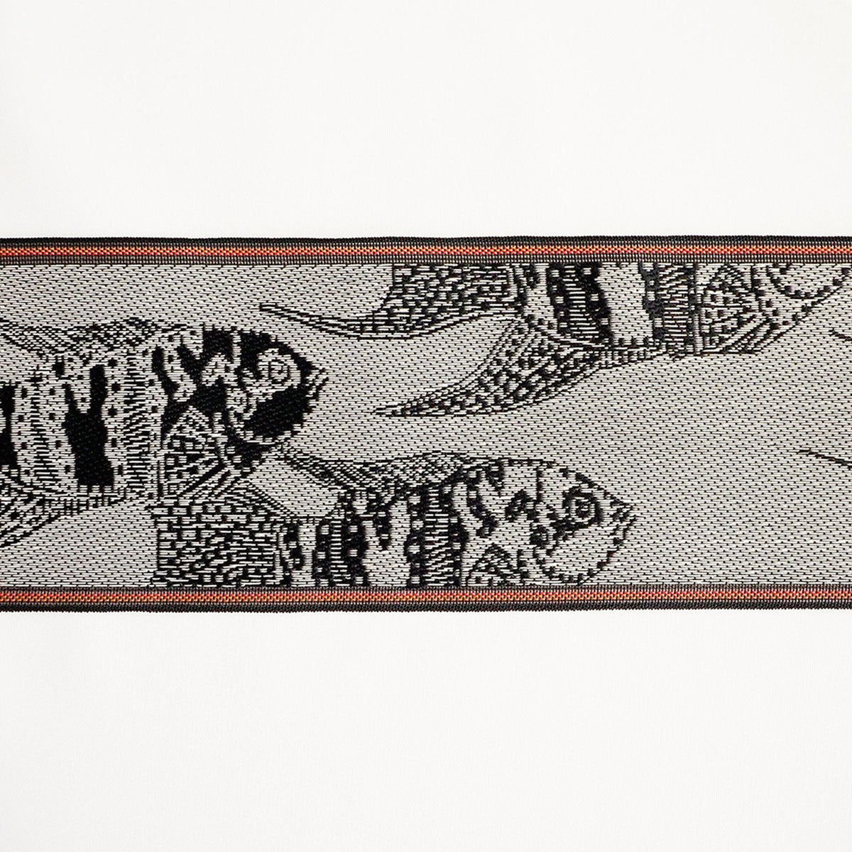 a close-up view of a black and white fish-like creature with intricate patterns and designs.