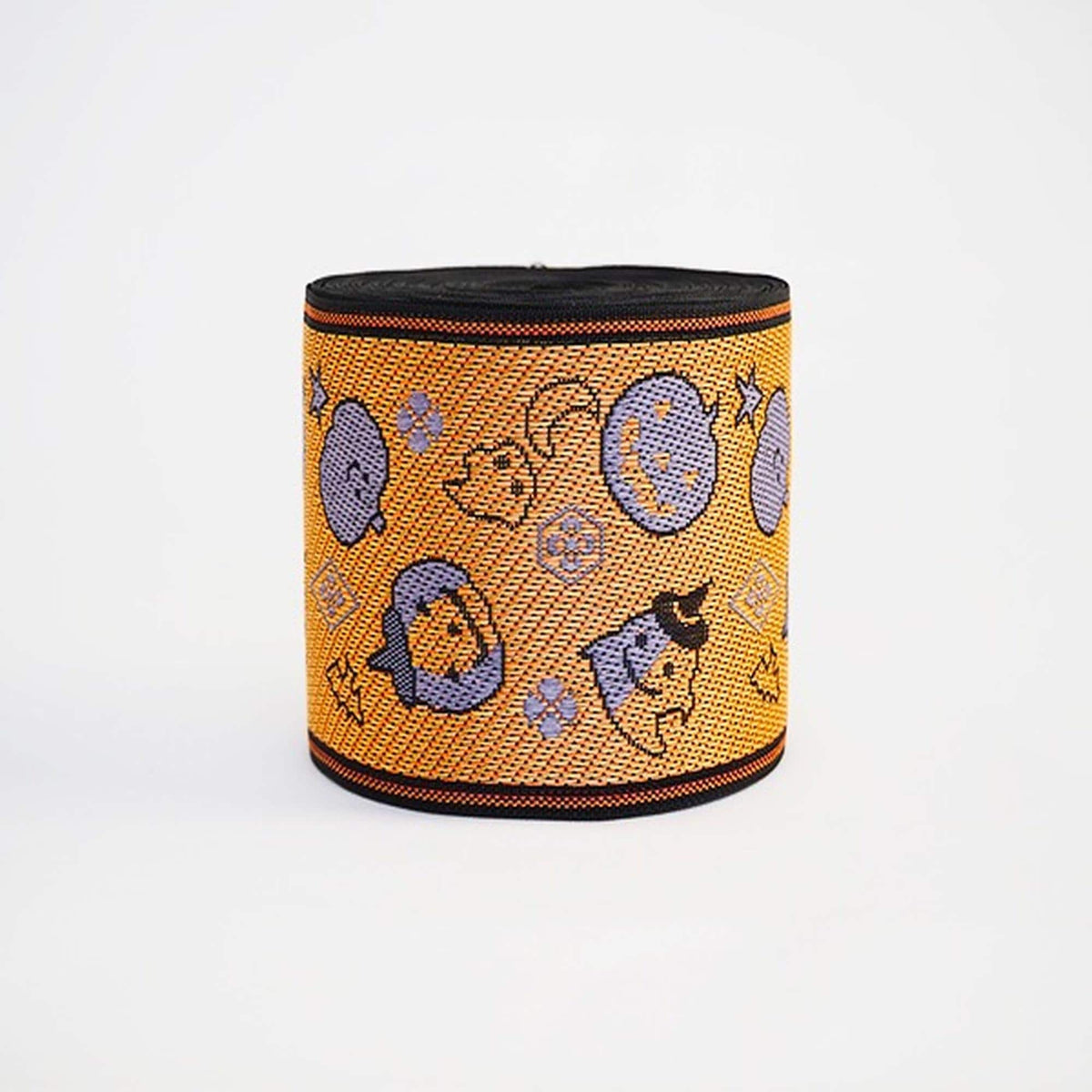 a Halloween-themed orange and black woven band with various cartoon-like characters and designs on it.