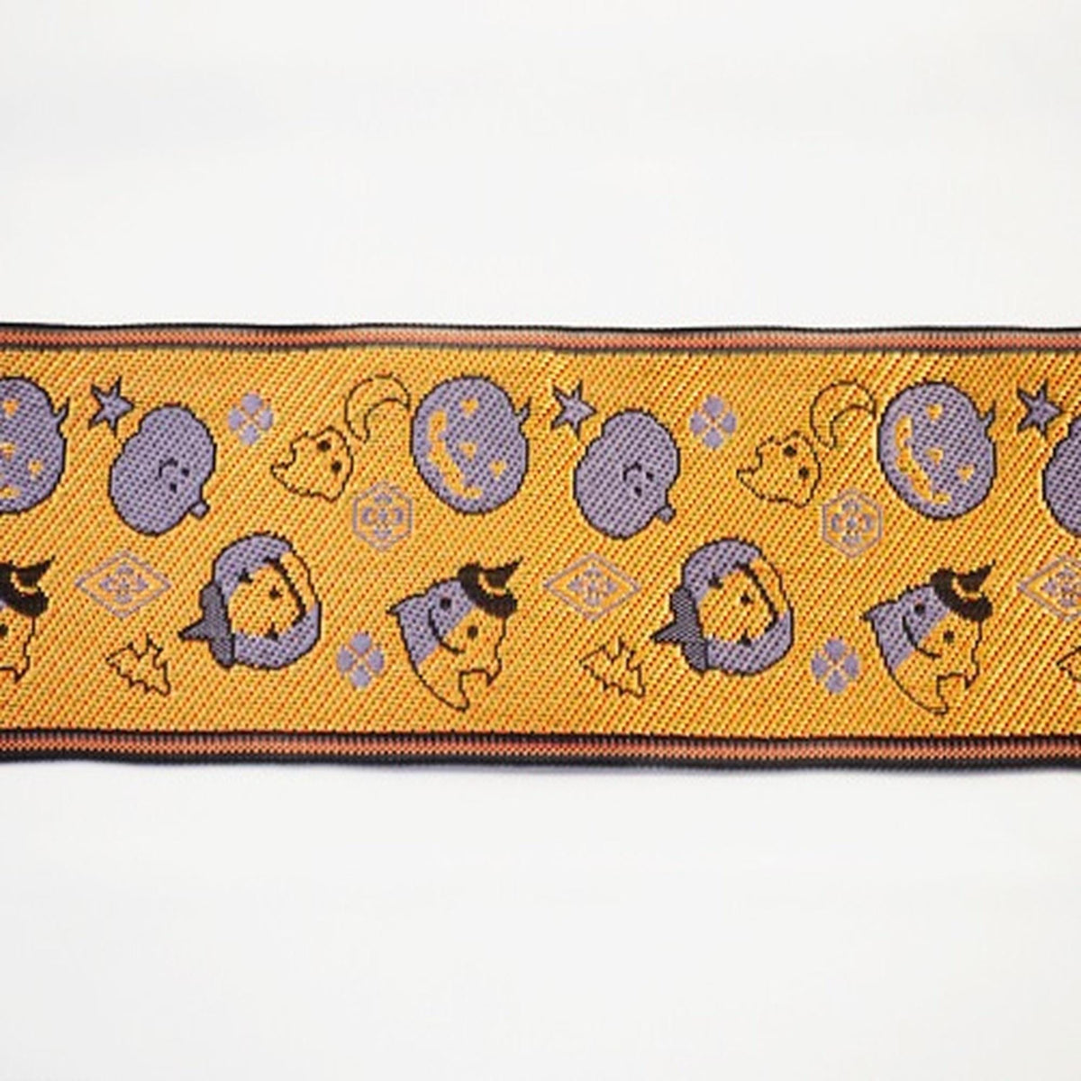 a repeating pattern of Halloween-themed characters and symbols on a yellow and black background.