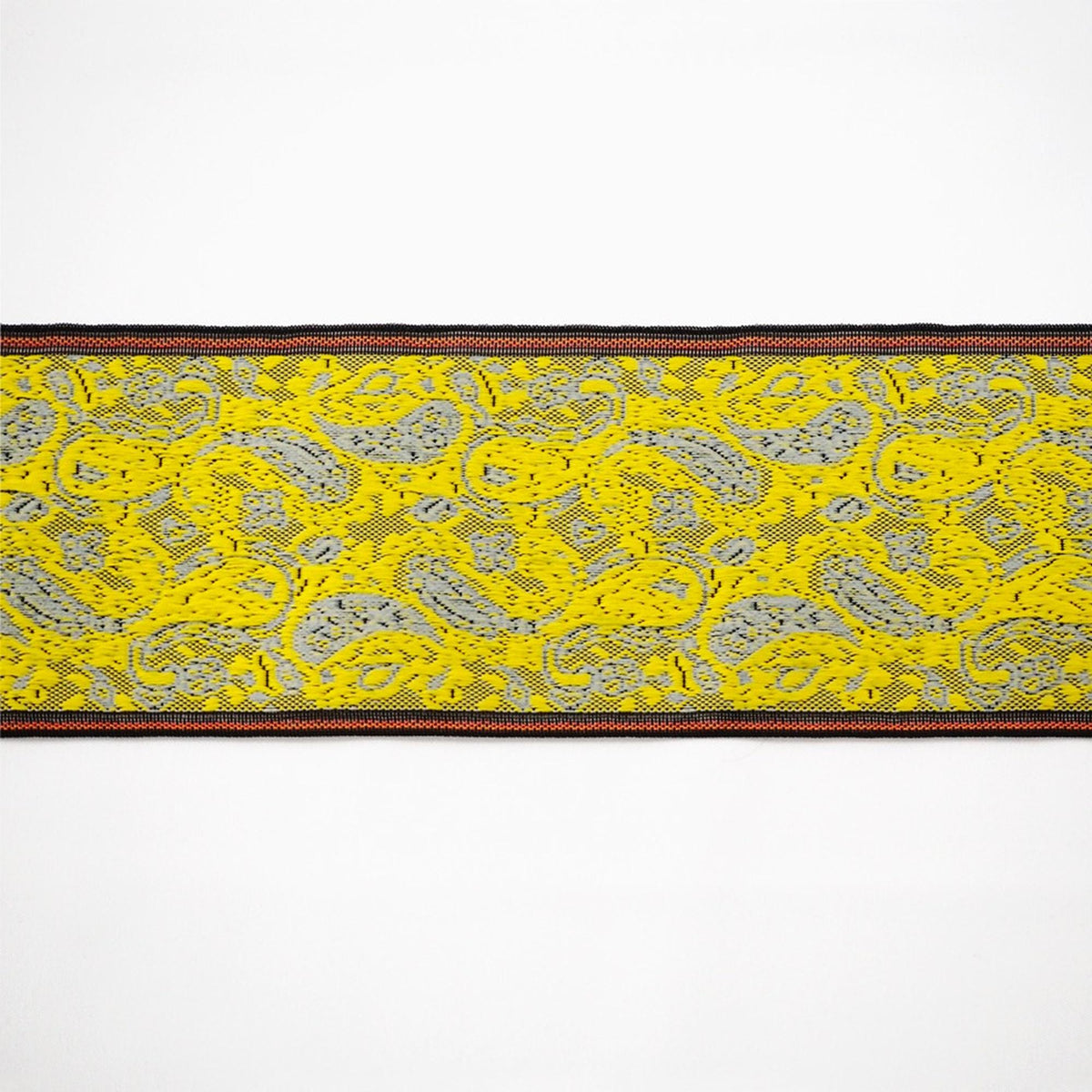 a vibrant yellow and black patterned fabric with a black border.