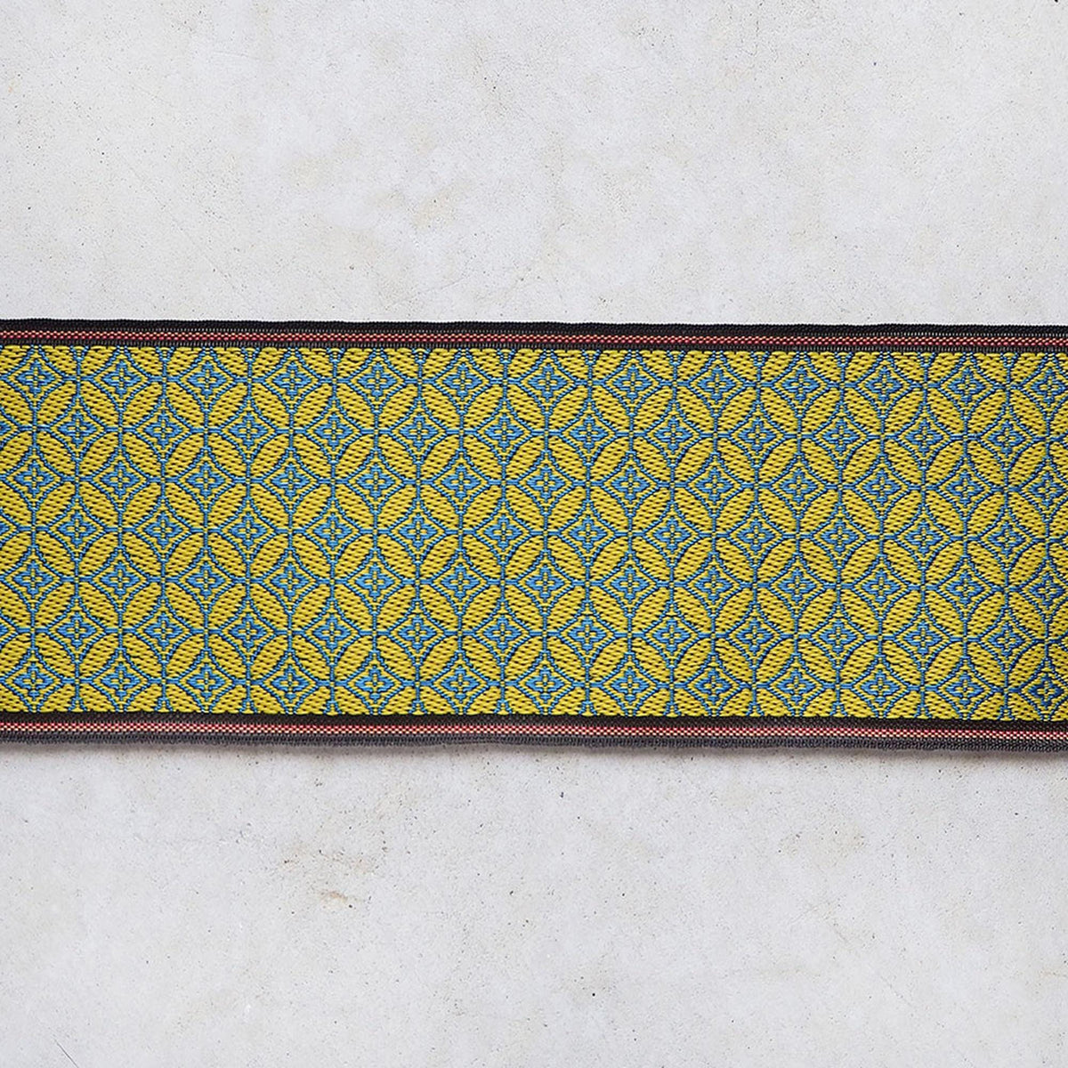 a decorative border with a repeating pattern of yellow and blue geometric shapes.