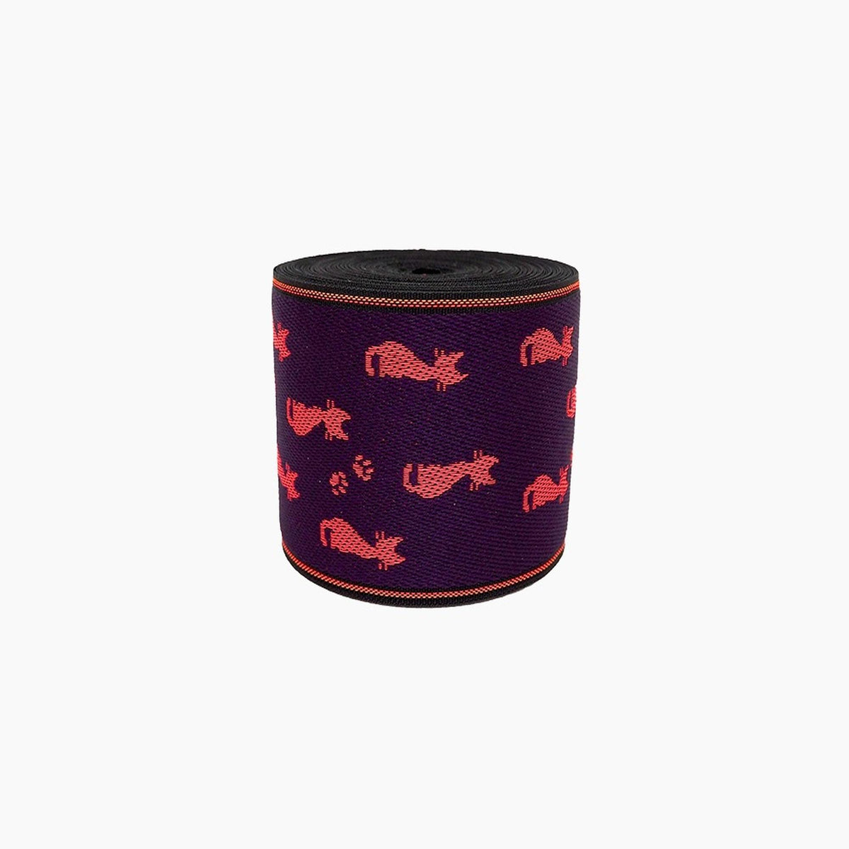 a cylindrical object with a pattern of red cats on a purple background.