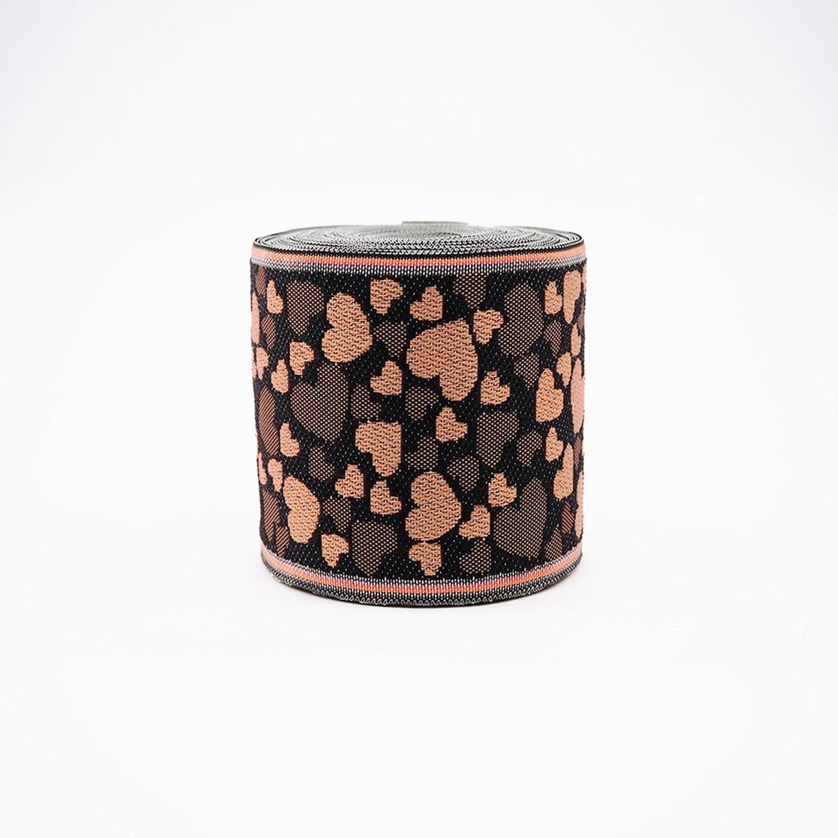 A round object with a black and brown heart-shaped pattern on it.