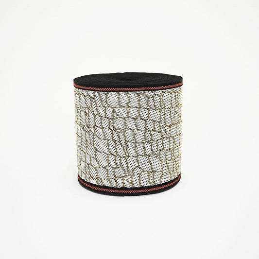 A cylindrical container with a black and white patterned design, featuring a black top and a red border around the edge.