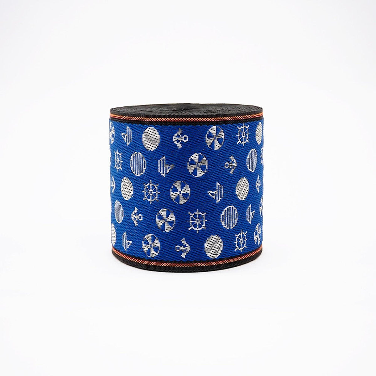 a blue and white patterned fabric with various circular and ship-related designs.