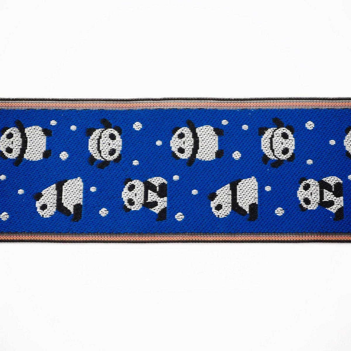 a repeating pattern of black and white panda silhouettes against a blue background, with small white dots scattered throughout the pattern.