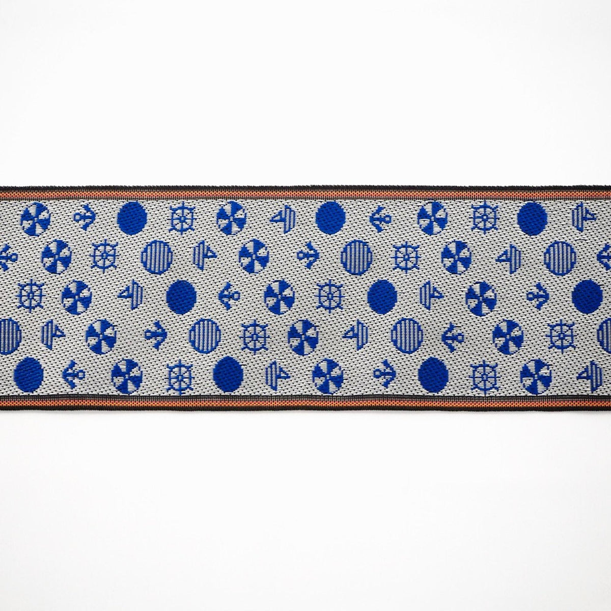 a repeating pattern of blue circles and white ships on a white background.