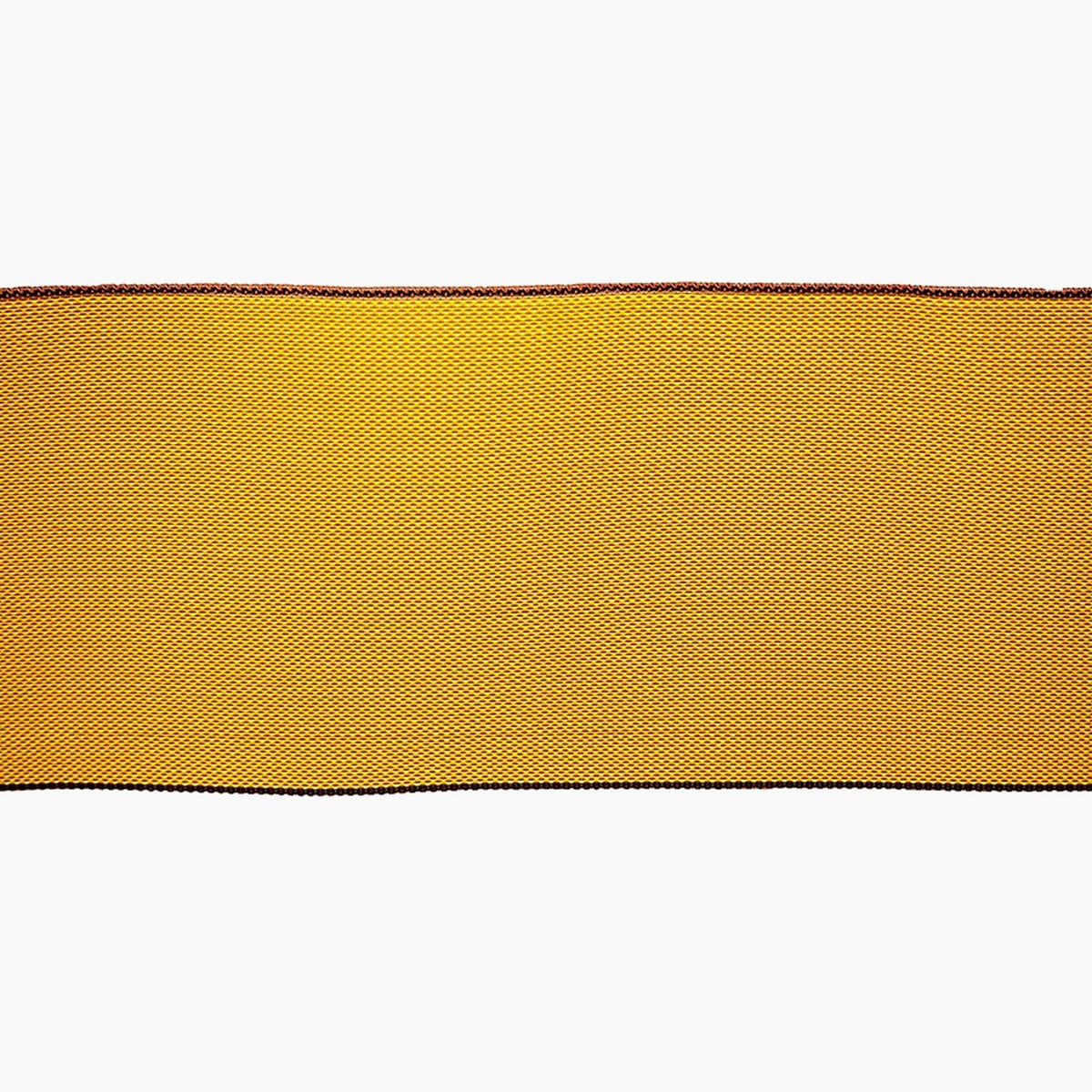 a close-up view of a yellow fabric with a black border, which appears to be a piece of material or a decorative element.