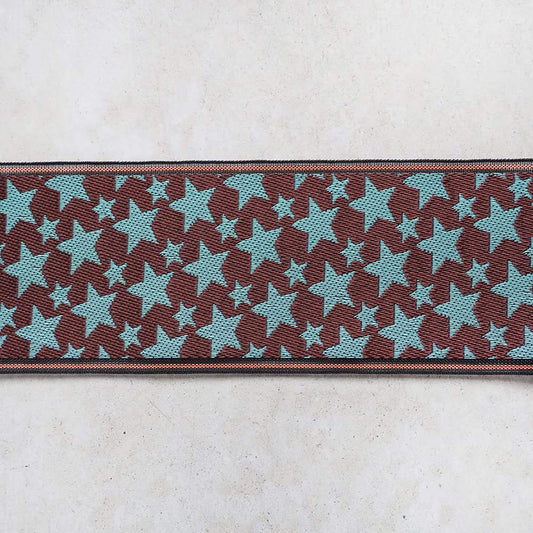 a repeating pattern of brown and blue stars on a white background.