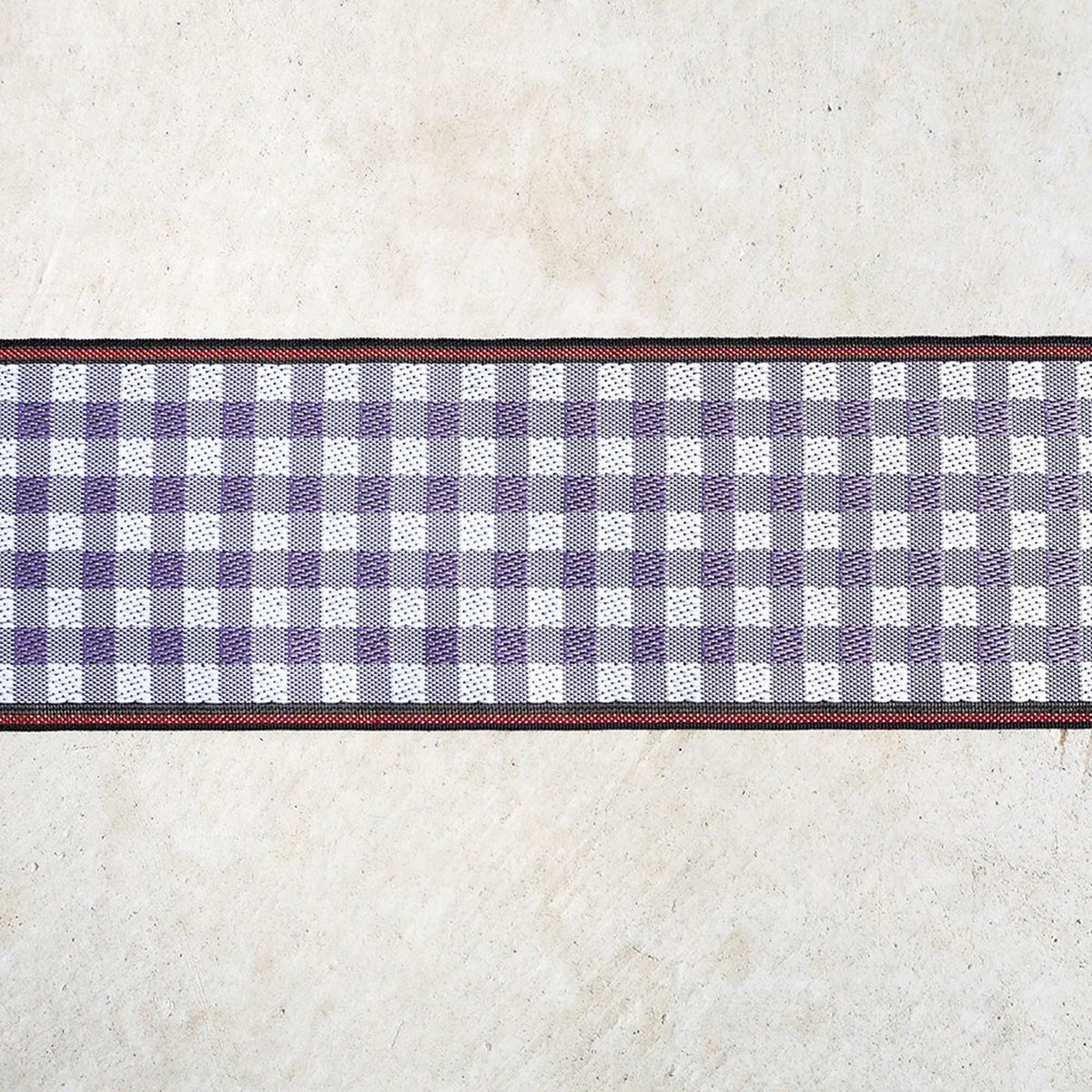 a checkered pattern on a white background, with a red border.