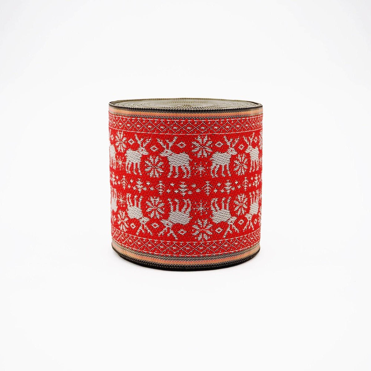 A red and white knitted or crocheted object with a repeating pattern of deer and snowflakes.