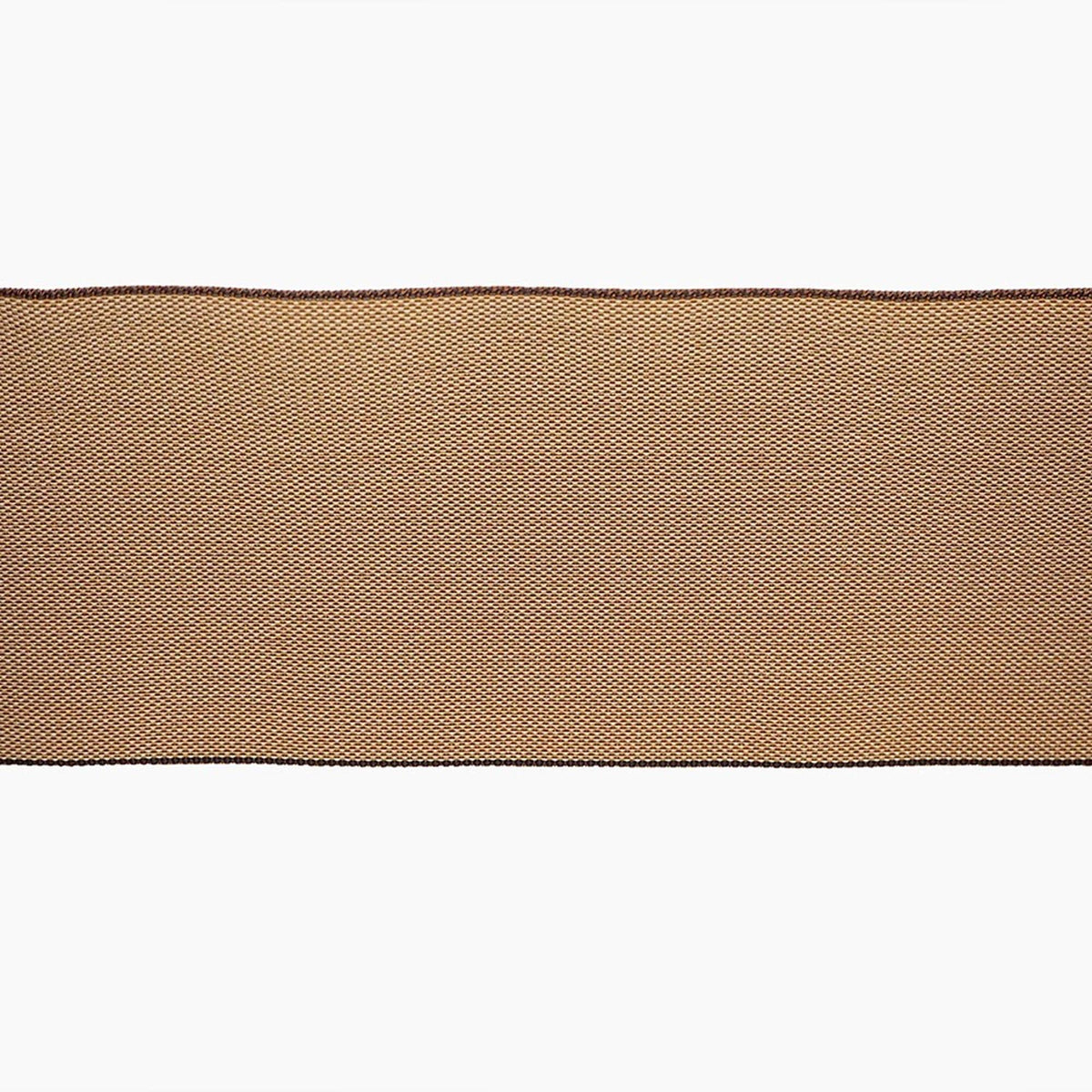 a close-up view of a brown fabric with a textured pattern, likely a piece of lace or a similar type of material.