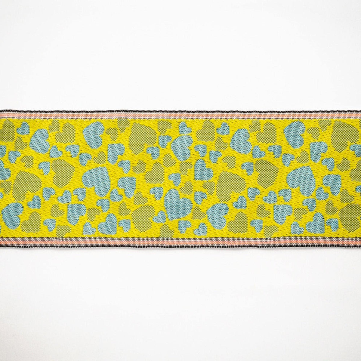 a vibrant yellow and blue patterned fabric with a repeating geometric design.
