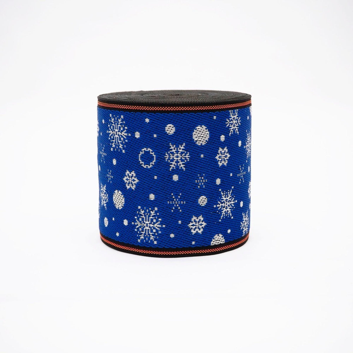 A blue and white snowflake-patterned fabric or ribbon is shown against a white background.