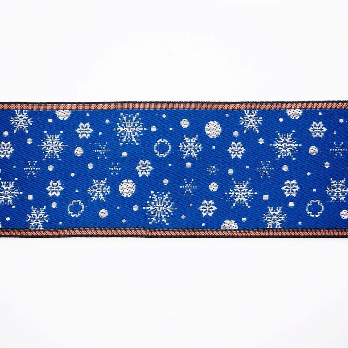 a blue fabric with a repeating pattern of white snowflakes on it.