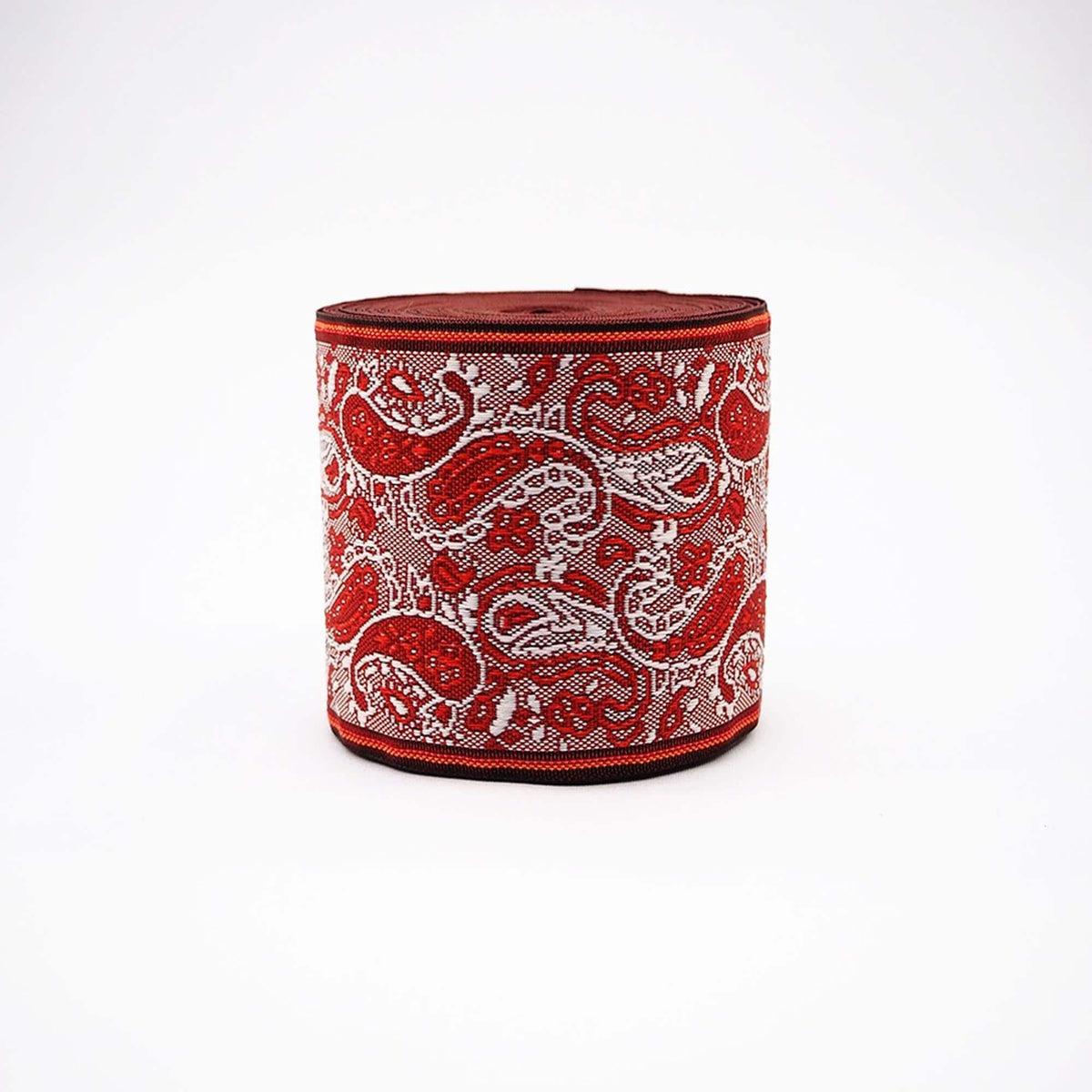a red and white paisley-patterned object, which appears to be a decorative item or a piece of art.