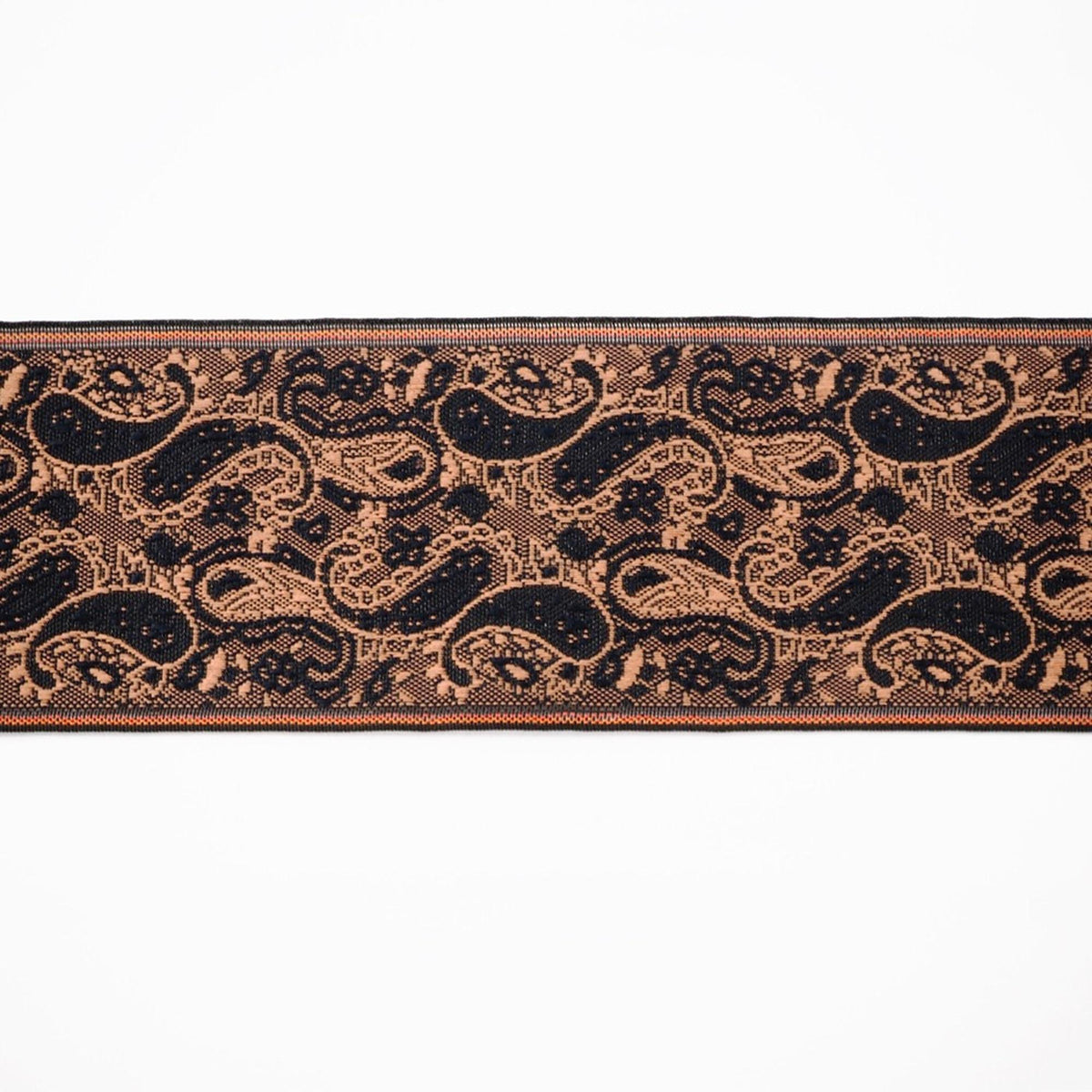 a decorative border with a repeating paisley pattern in shades of black and brown.