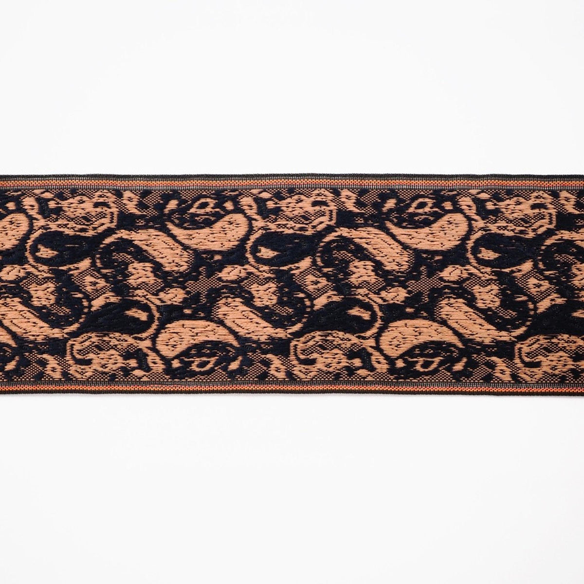 a repeating pattern of black and orange shapes, creating a visually striking and intricate design.
