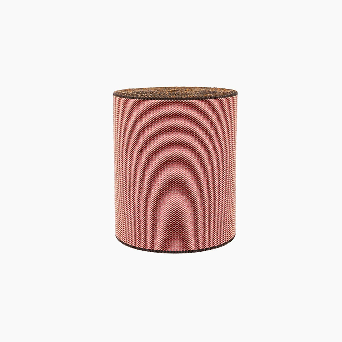 A cylindrical object with a textured surface, resembling a piece of fabric or a cylindrical container.