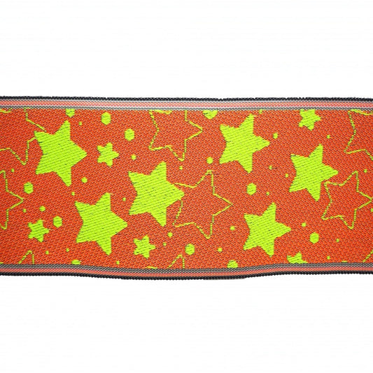 a vibrant, colorful pattern of orange and green stars on a fabric or textile.