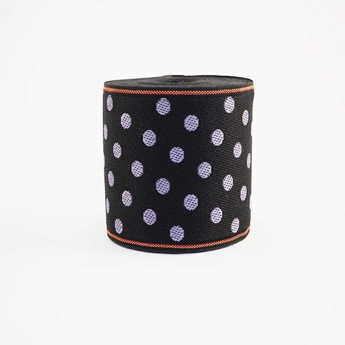 A black and orange polka dot fabric or material is shown against a white background.