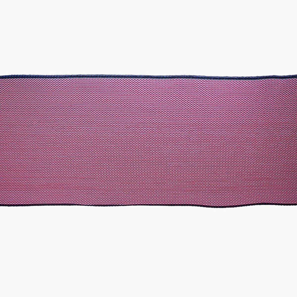 a close-up view of a red and black fabric, possibly a ribbon or a decorative material.