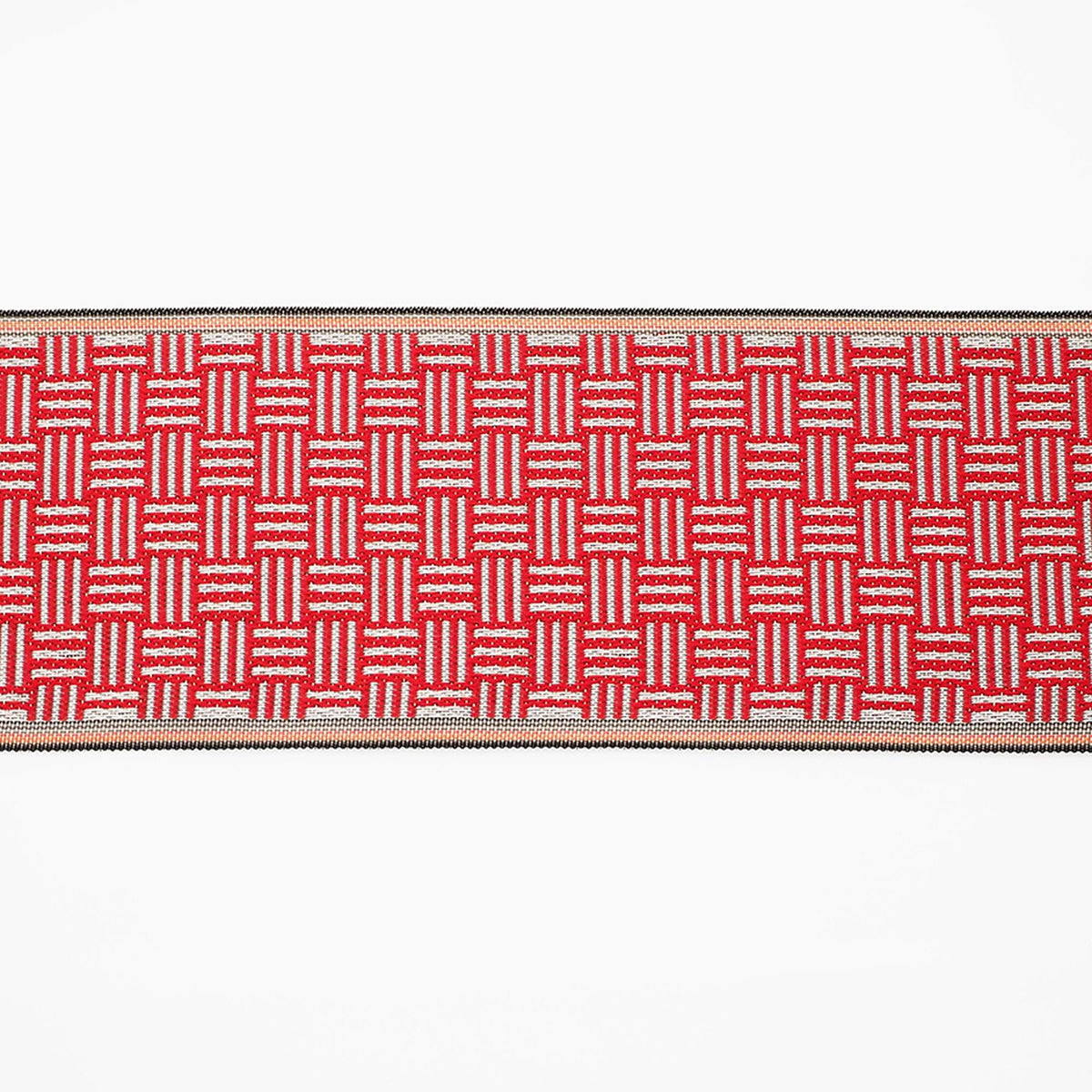 a red and white woven textile with a repeating pattern of squares and rectangles.
