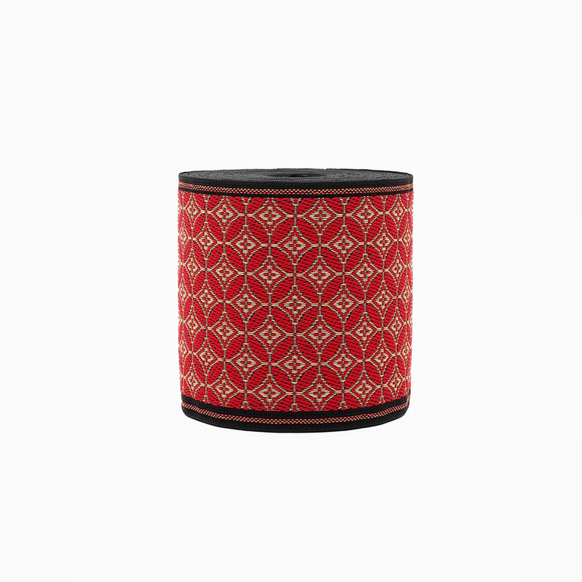 A cylindrical container with a red and black geometric pattern, featuring a black border around the top edge.