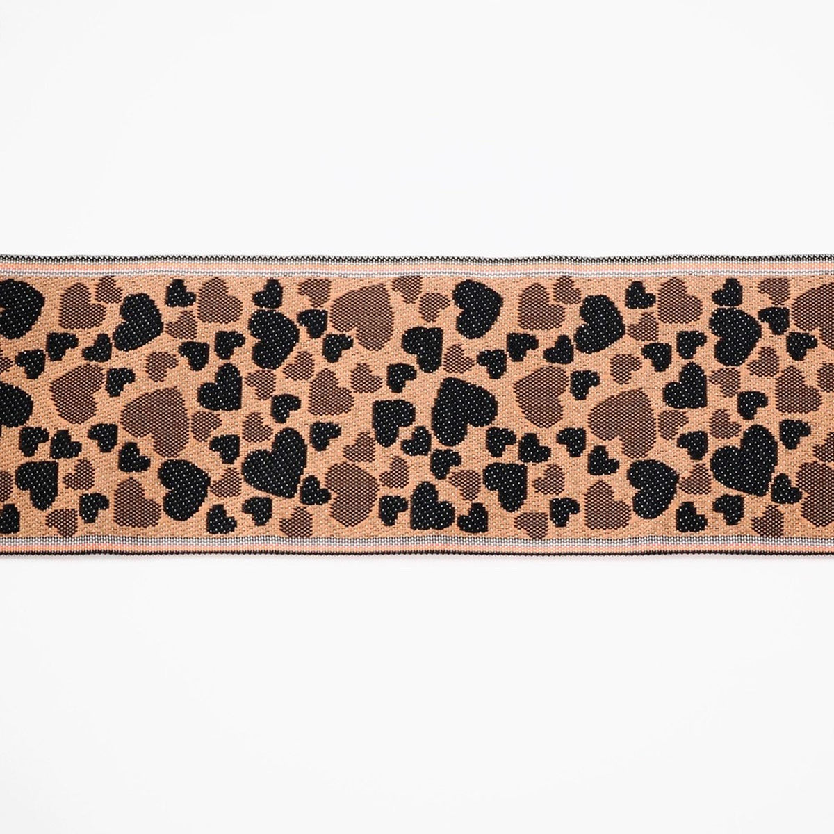 a pattern of brown hearts on a beige background.