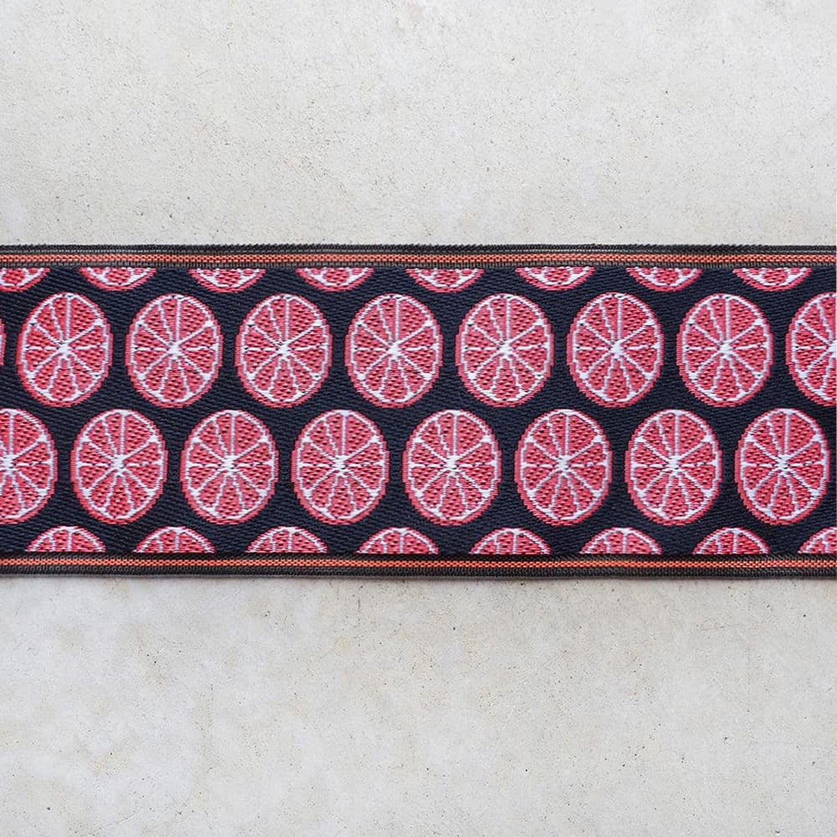 a repeating pattern of red and black circles on a black background.