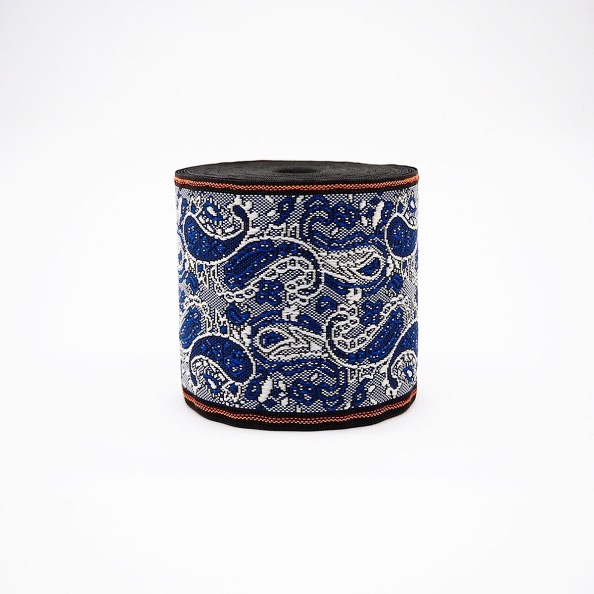 A roll of blue and white paisley-patterned ribbon or fabric.