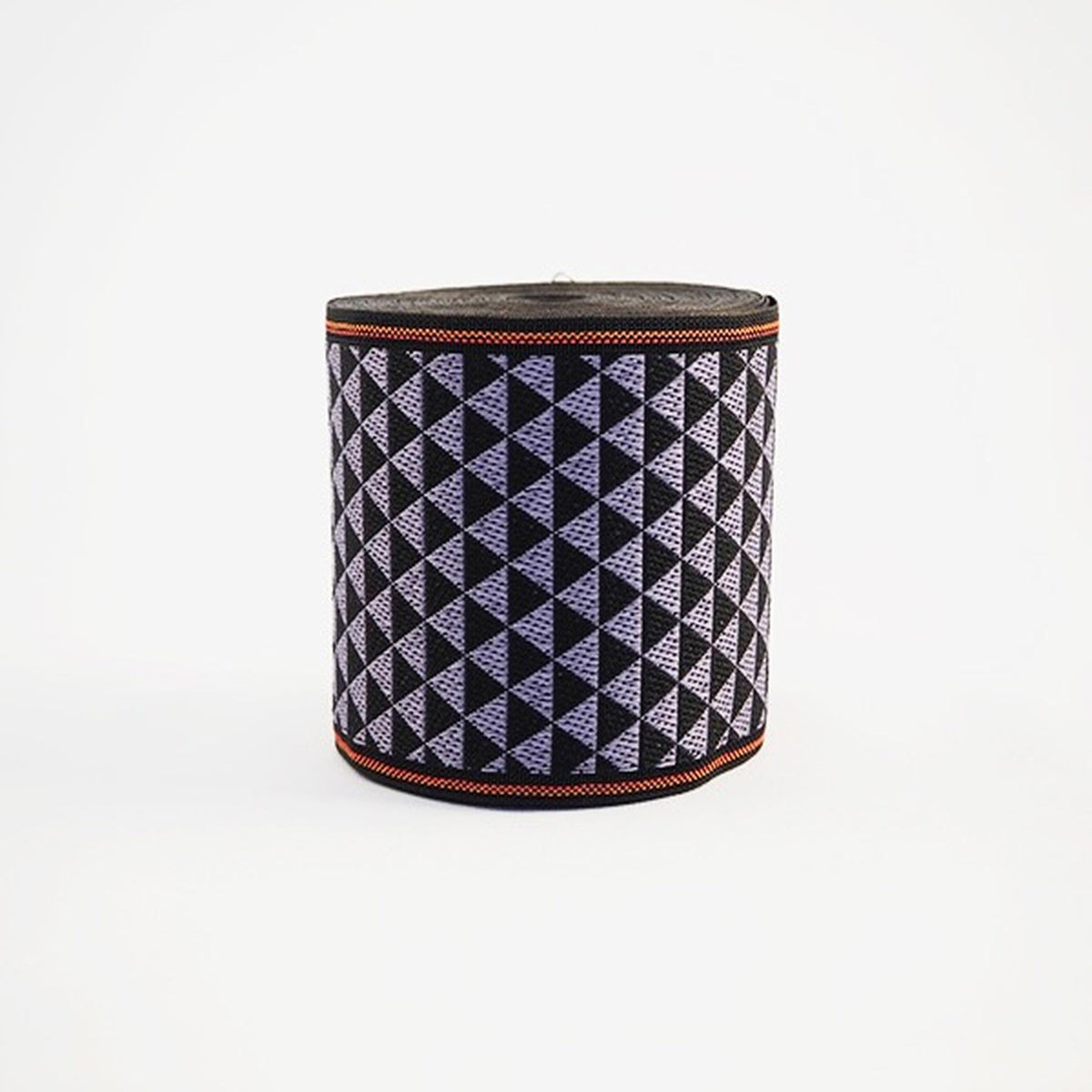 A cylindrical object with a geometric pattern in shades of purple and black.